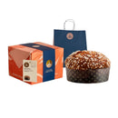 A packaged box of Fiasconaro Italian Cioccolato Chocolate Panettone with a gift bag and the panettone beside it.