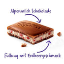A piece of Milka Strawberry Yogurt Chocolate with the filling visible, shown with German text labels.