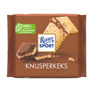 A packaged bar of Ritter Sport Milk Chocolate with Butter Biscuits, showing chocolate pieces, biscuits and the brand logo.