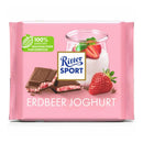 A wrapped bar of Ritter Sport Chocolate Strawberry Yogurt Bar showing the brand logo, chocolate squares and strawberries.
