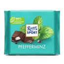 A packaged bar of Ritter Sport Milk Chocolate with Peppermint, showing chocolate pieces, mint leaves and the brand's logo.
