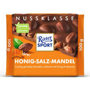 A packaged bar of Ritter Sport Honey Salt Almond Chocolate showing the brand logo, the chocolate with almonds and honeycomb.