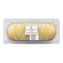 A sealed package of Niederegger Weissbrot White Marzipan Loaf, showing the loaf through the clear tray and the brand label.