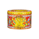 A decorated tin of Dolce & Gabbana Sicilian Citrus and Saffron Panettone by Fiasconaro with citrus artwork and the brand