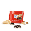 A packaged bar of Ritter Sport Dark Chocolate with Marzipan with chocolate squares, marzipan pieces and almonds beside it.